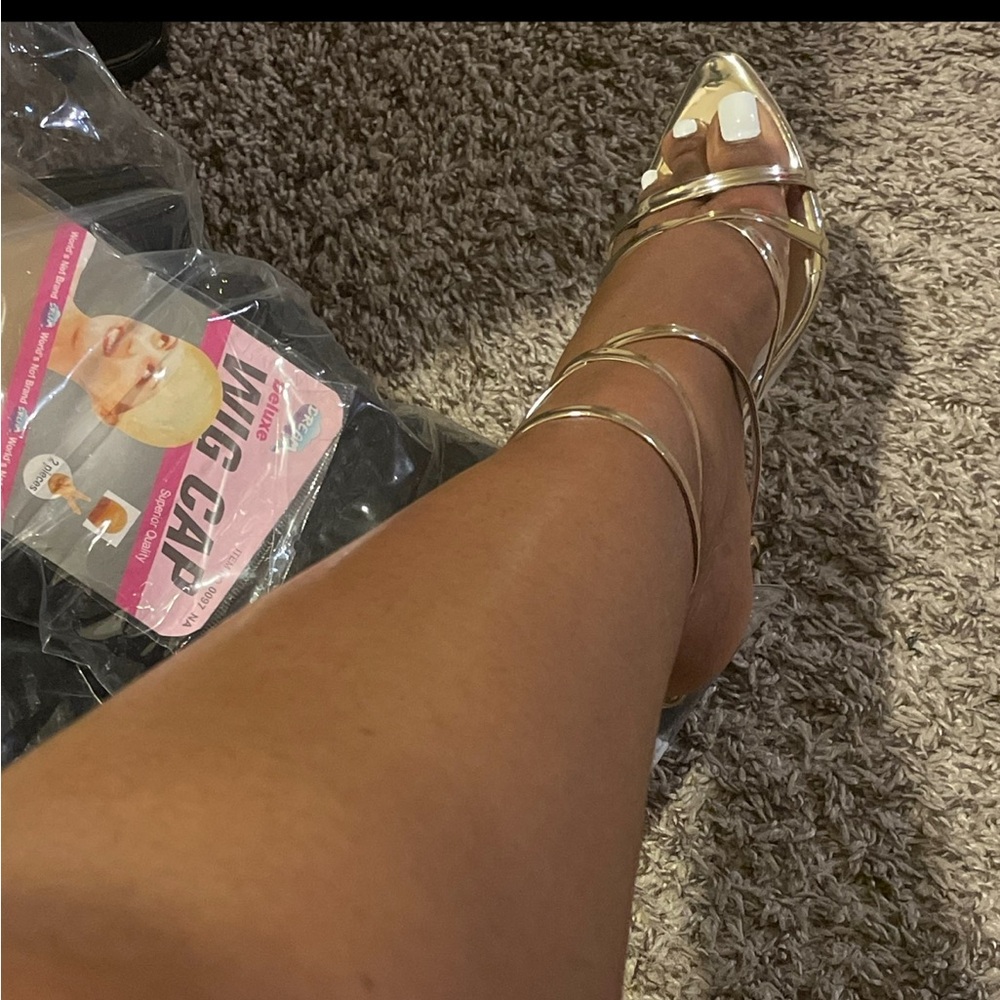 Brand new, never worn. Gold stiletto heels. Runs slightly big, can fit a 6/6.5